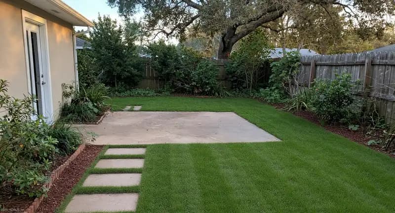 The same property after D&D: a striped, edged, fully kept yard